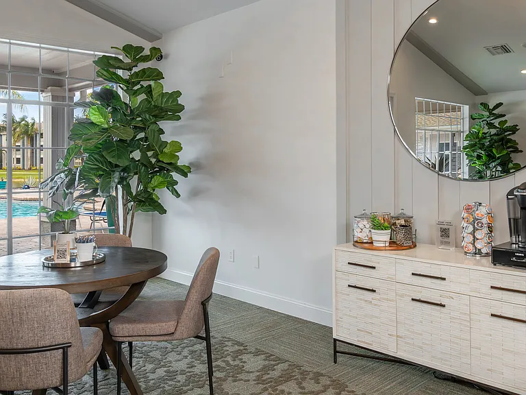 Our clubhouse offers a cozy coffee station and comfortable seating with a serene view of the pool, making it a favorite resident gathering place.