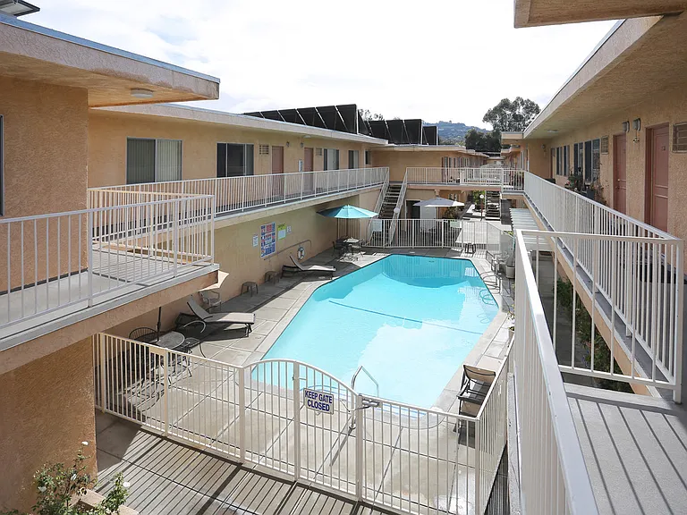 Second floor view of large solar heated pool in Woodbridge Park courtyard.