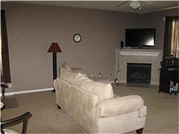 Corner fireplace with gas logs.