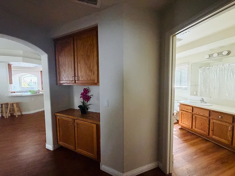 Shared hallway with easy access to the kitchen and bathroom