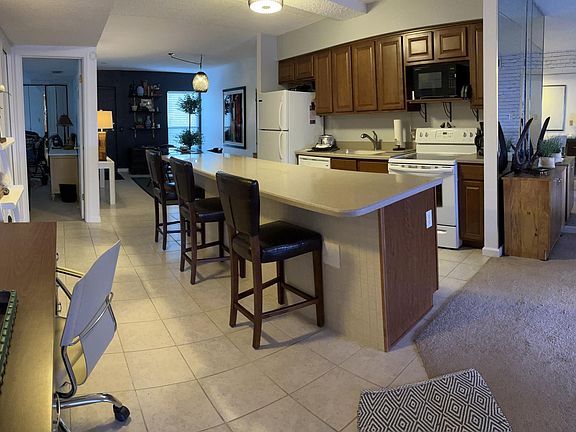 Convenient kitchen island for eating. Hall desk for work convenience.