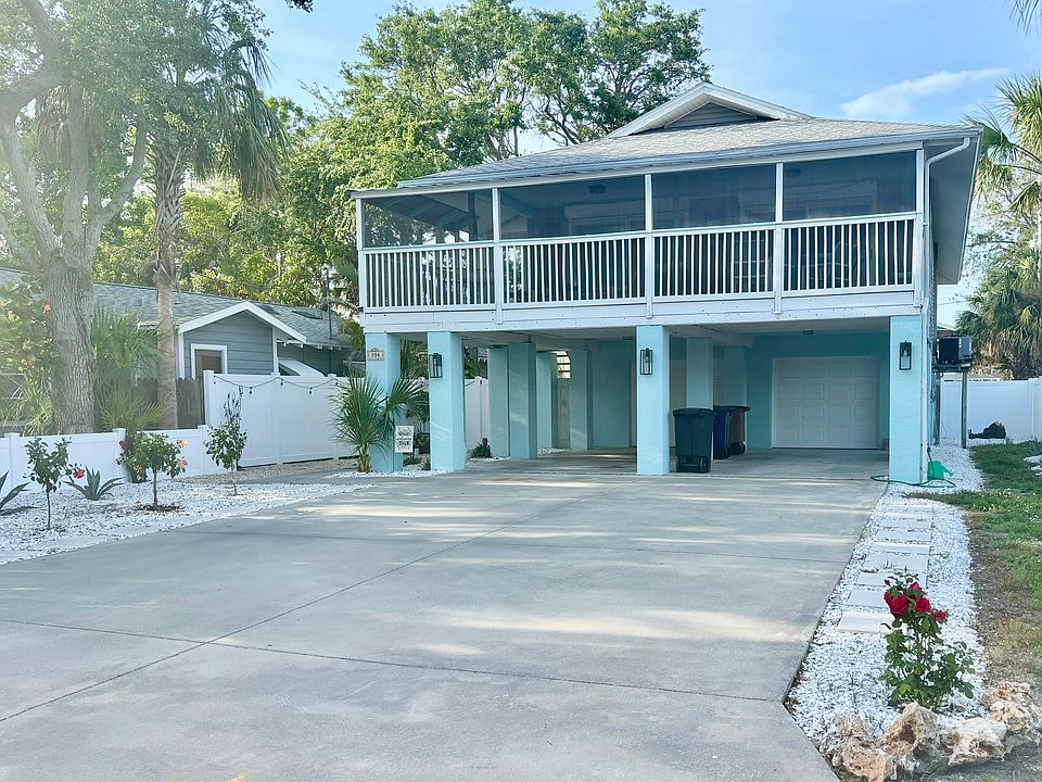 Large carport & driveway. New landscaping & fencing.