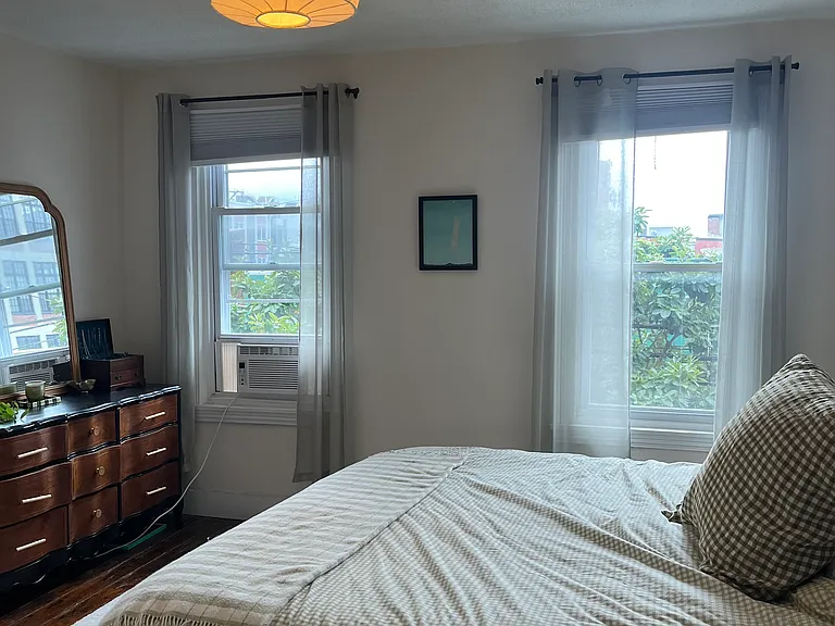 Large primary bedroom with updated California closet