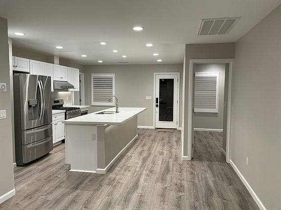Kitchen with included stainless steel appliances