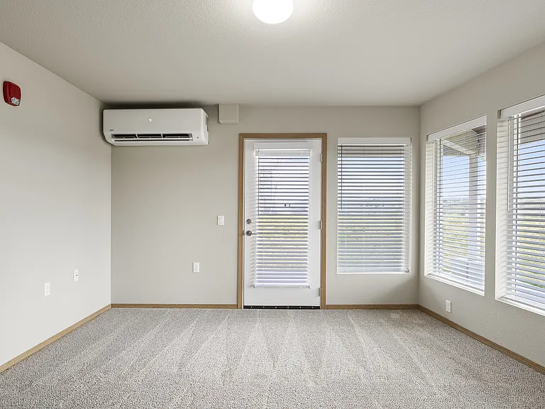 Living Room With Covered Patio Outside