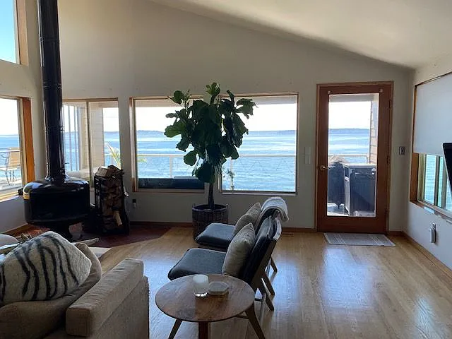 Living room with fireplace and hardwoods throughout.