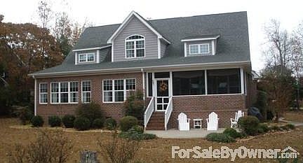 Home Rear overlooking NSCC 4th green
						:
						Lower windows left in MBR sun parlor; center in breakfast nook; rt-screen porch