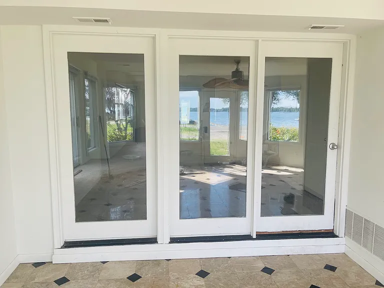 Looking into the living room from the 4-seasons room. Think of all the plants you could put in this (heated in the winter
) room! So much sunlight.