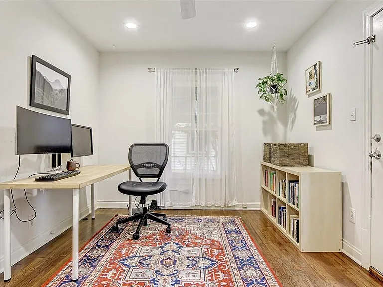 Second Bedroom, great as a bedroom or an office with a door that opens to the private fenced in backyard with large back patio
