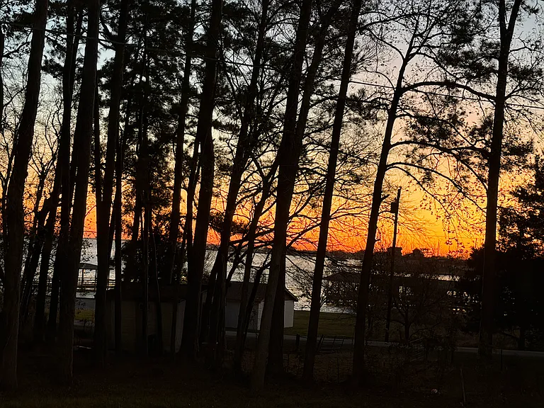 Beautiful sunset at night from front and side porch.