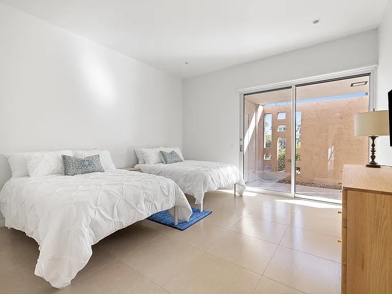 GUEST BEDROOM HAS BACK PATIO ACCESS TO GREENBELT AND POOL