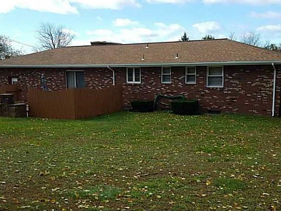 Exterior Back. NICE BACK YARD WITH PRIVATE PATIO/ BRICK GRILL