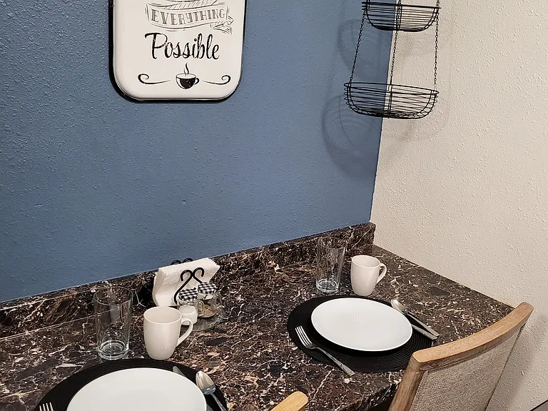 Basement Kitchenette has eating space for two.