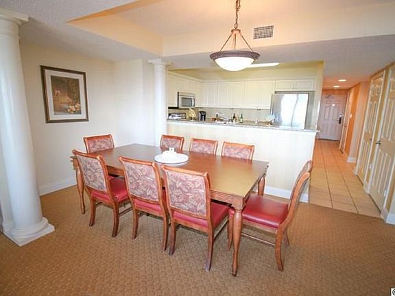 The dining area consists of an eight seater dining table and