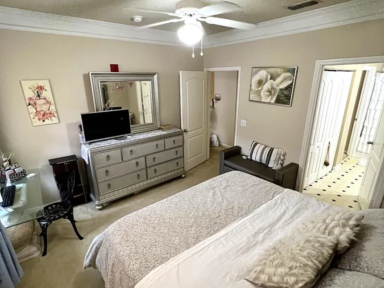 Master bedroom furnished by a prior tenant