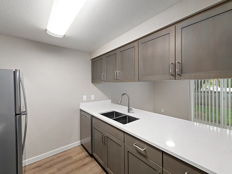 Renovated, open-concept kitchen with breakfast bar.