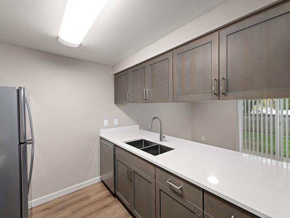 Renovated, open-concept kitchen with breakfast bar.
