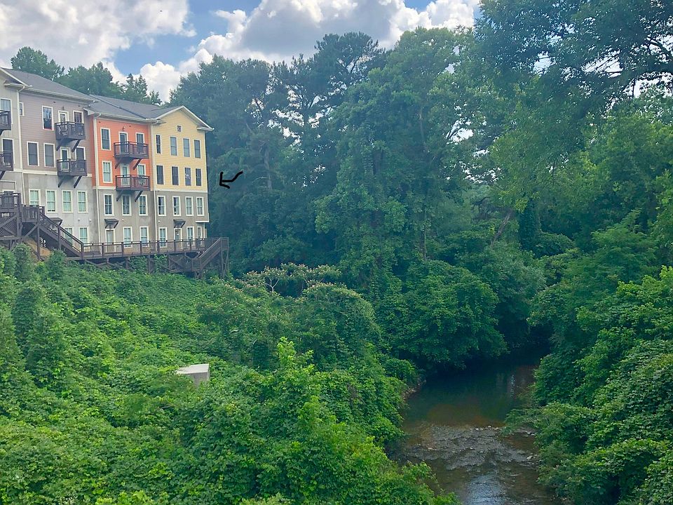Overlook condos from bridge. Unit is the corner unit with balcony looking away from street