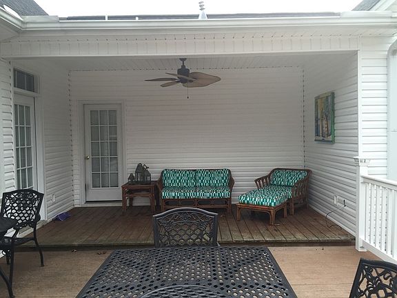 Back porch : Covered nook overlooking pool and deck