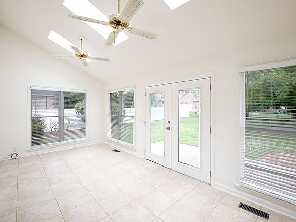 Sunroom with Skylights and exit to patio