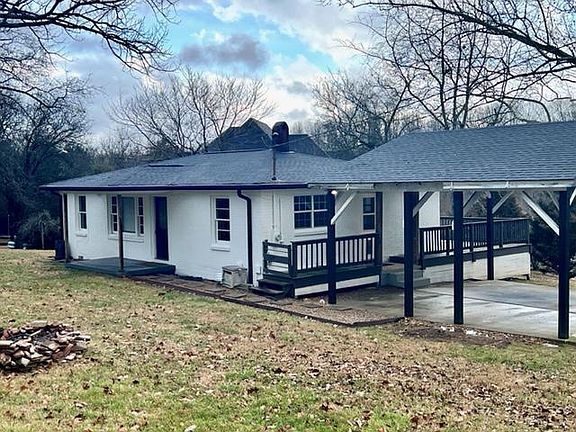 Large front and side yards with firepit. All new roof