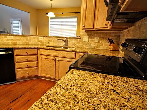 Granite counters and backsplash, hardwood floors