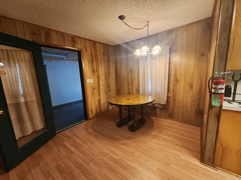 Dining area. Door on left is secured home entrance from foyer.