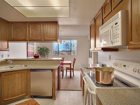 Remodeled kitchen with new engineered granite countertops
