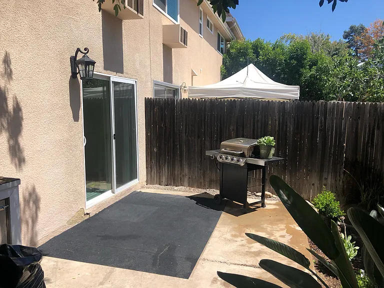 BACKYARD...BBQ INCLUDED. NEW OUTDOOR LIGHT...AUTO TURN ON AT DUSK.