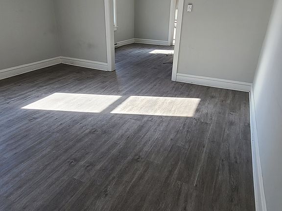 Large living room and dining room - open floor layout throughout the living area - new paint to be completed prior to 3/1 move-in date