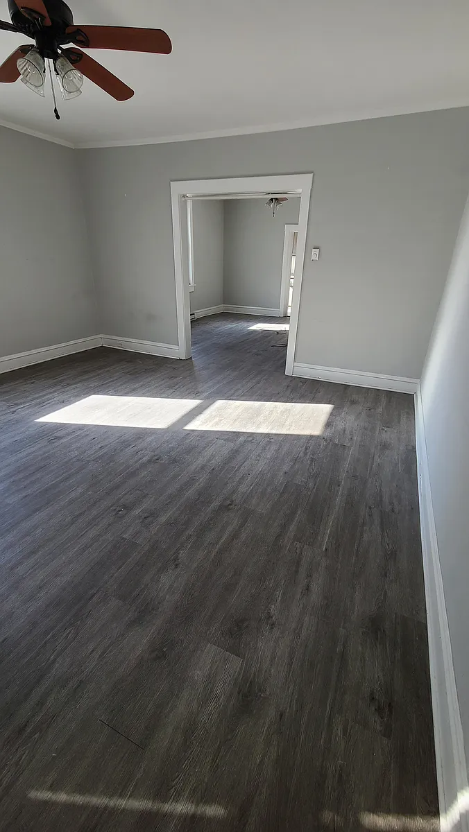 Large living room and dining room - open floor layout throughout the living area - new paint to be completed prior to 3/1 move-in date - 629 N New St #1S