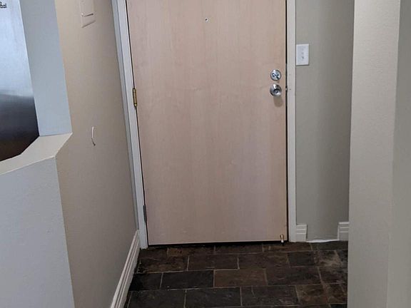 Entry: slate floors, and laundry/utility nook