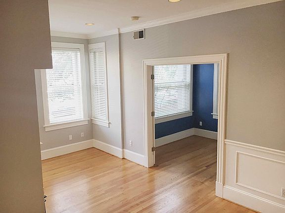 Looking toward the front of the apartment. Den in the background.