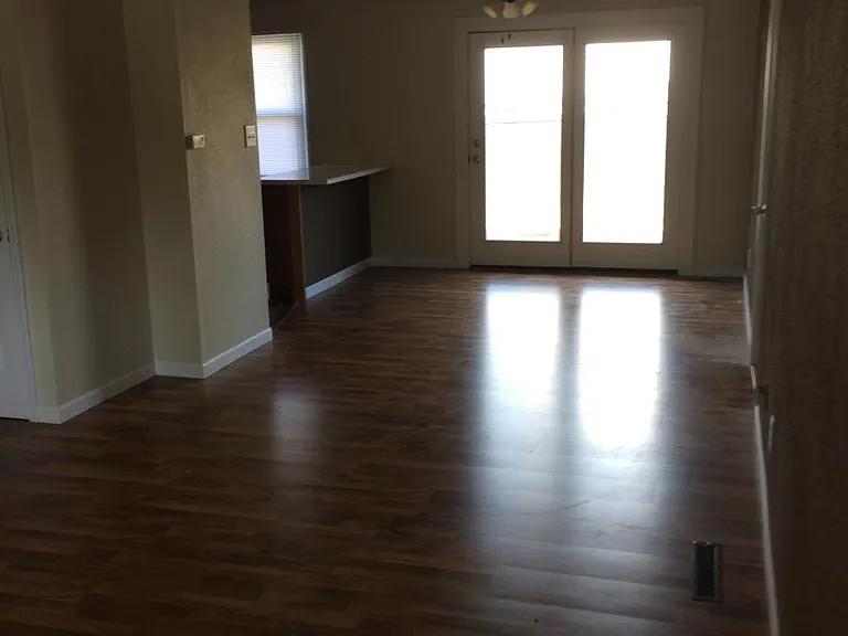 Please note: photos were taken prior to renovation. New luxury vinyl plank flooring, fresh paint throughout, new stainless steel appliances, and a new peninsula countertops are currently being installed.