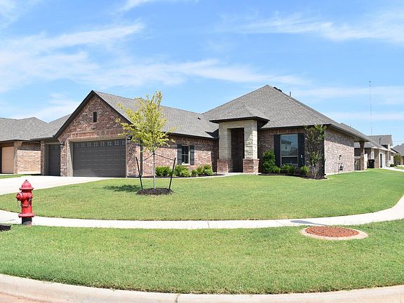 Curb appeal galore! And home sits on a large, corner lot, so neighbors only on one side. oversized 3-car garage with large driveway. Quiet, upscale neighborhood - Siena Ridge - located at the corner of NE 27th and Bryant. Easy access to everywhere!