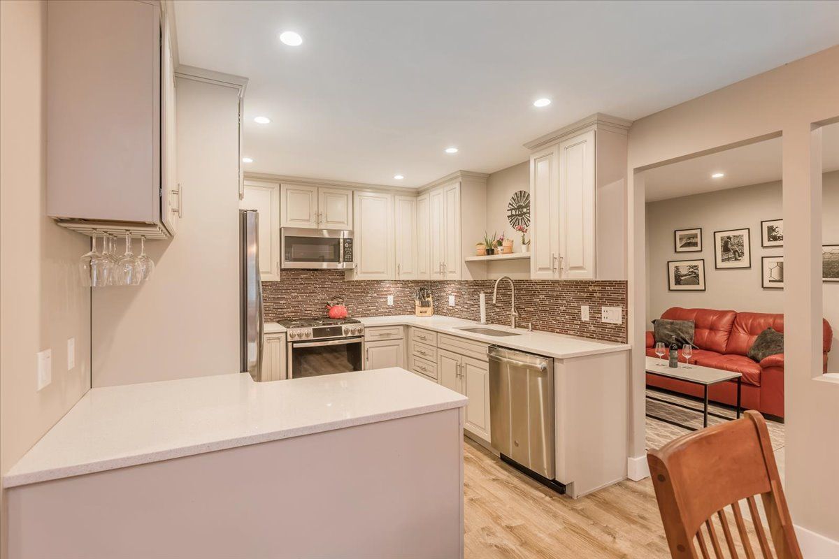  Main Level: Kitchen Renovated in 2018 with Quartz Countertops and Stainless Steel Appliances