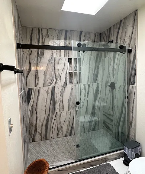 Master bath with natural sunlight via skylight