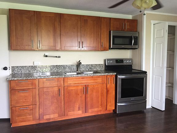 Kitchen with Granite Countertops and stainless steel applian