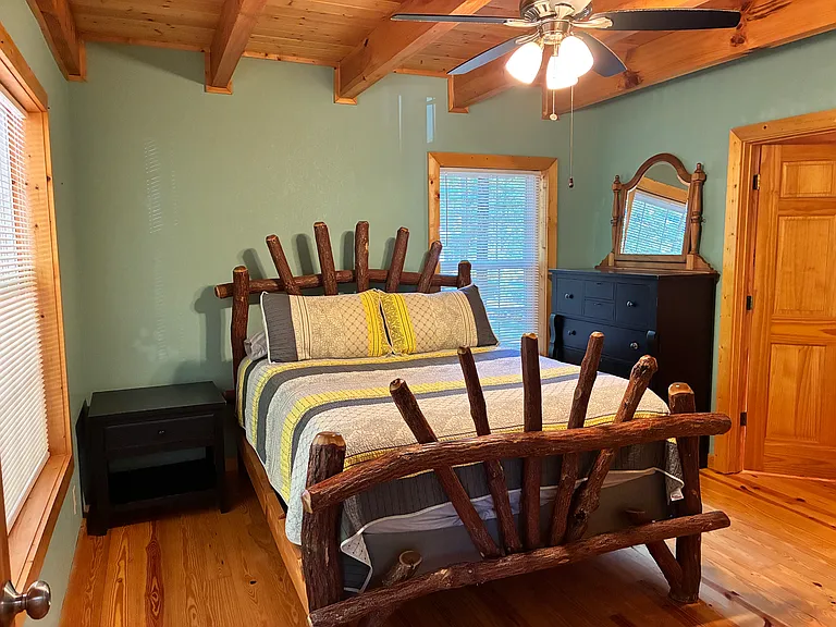 Downstairs bedroom with redwood log bed