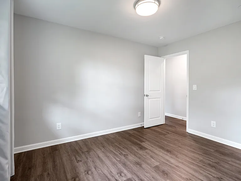 Cozy third bedroom, ideal for a home office or remote work setup.
