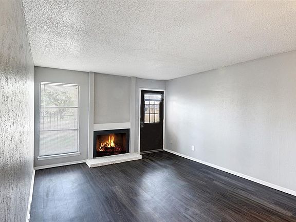 LIVING ROOM WITH WOOD BURNING FIREPLACE