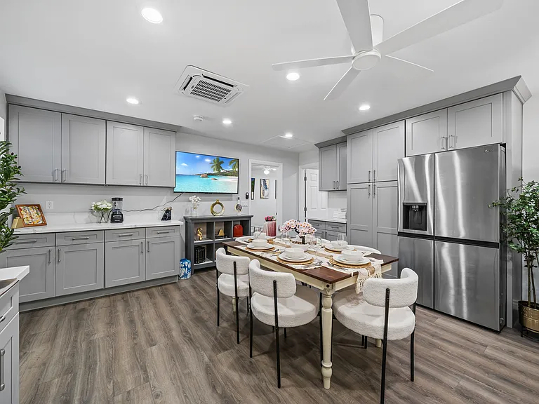 Enjoy your meals at the cozy dining space with easy access to kitchen appliances and essentials.