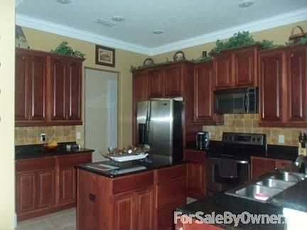 Kitchen with a bar - facing den