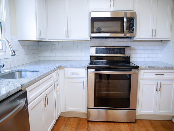 New kitchen: Stainless steel appliances with granite countertop
