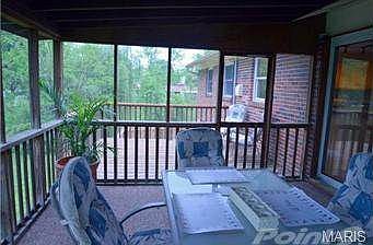 Screened sunroom with adjacent deck
