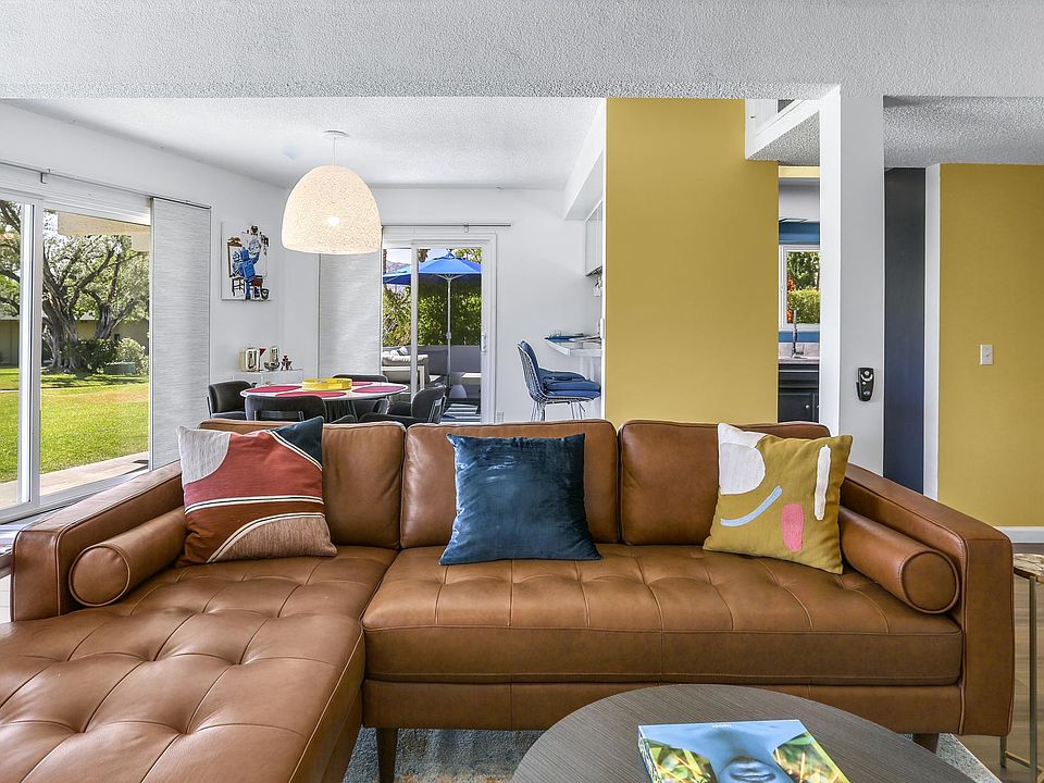 Open concept living room, dining and kitchen areas