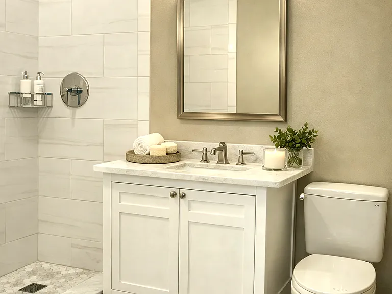 Upgraded bathroom w/sleek walk_in shower and refined modern finishes