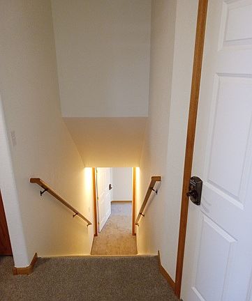 Wide staircase to lower level unit