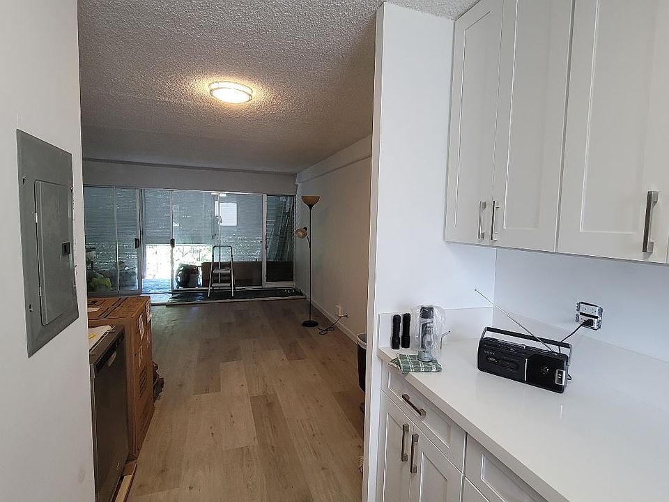 living room view from kitchen. Tools will be removed and the unit will be professionally cleaned before move-in date.