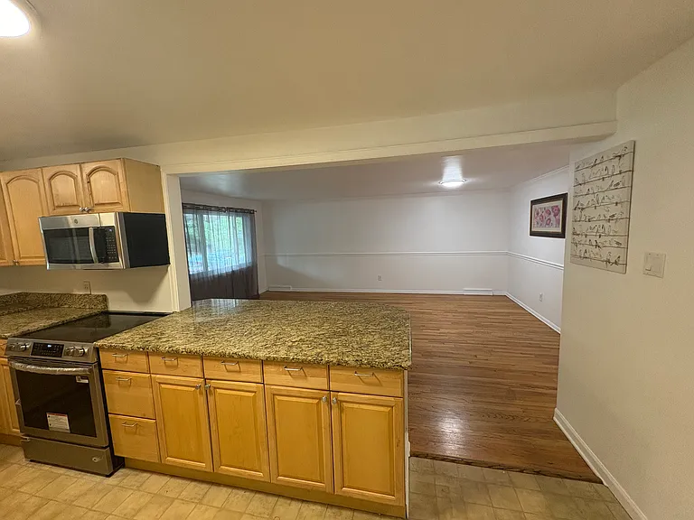 view from kitchen into oversized dining/living area